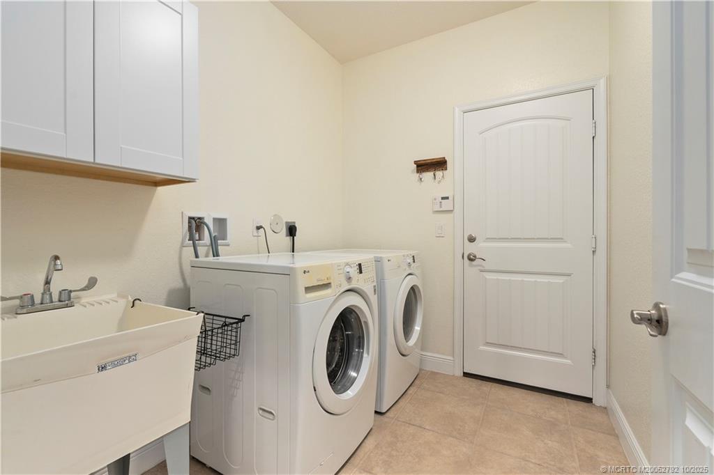 1455 Southeast Conference Circle Stuart, FL 34997 - Photo 39 of 69 a utility room with dryer and washer