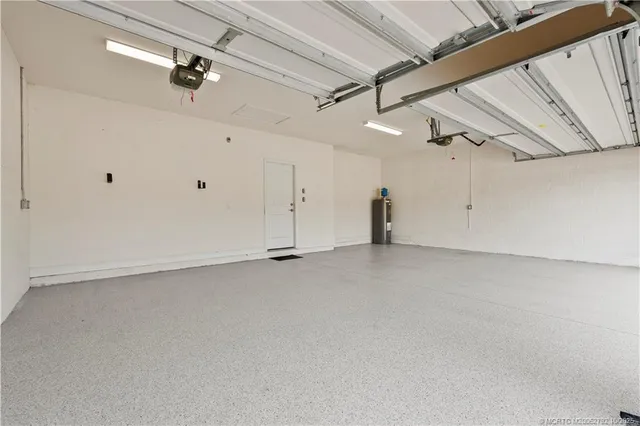 an aerial view of a tennis ground and a building