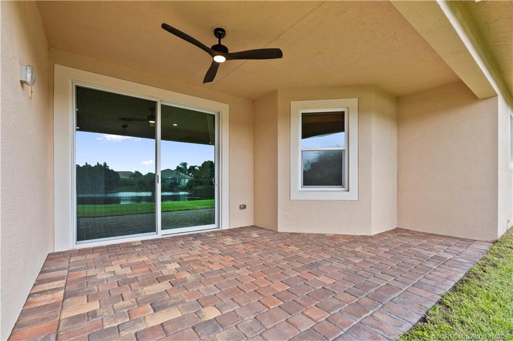 1455 Southeast Conference Circle Stuart, FL 34997 - Photo 43 of 69 a view of an empty room with window and ceiling fan