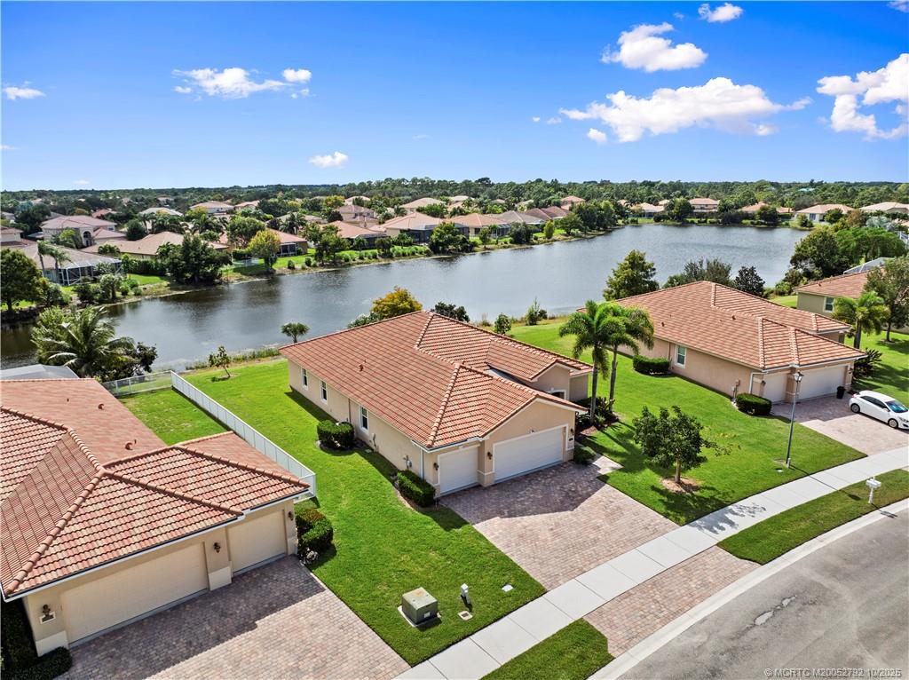 1455 Southeast Conference Circle Stuart, FL 34997 - Photo 49 of 69 a aerial view of a house with a lake view