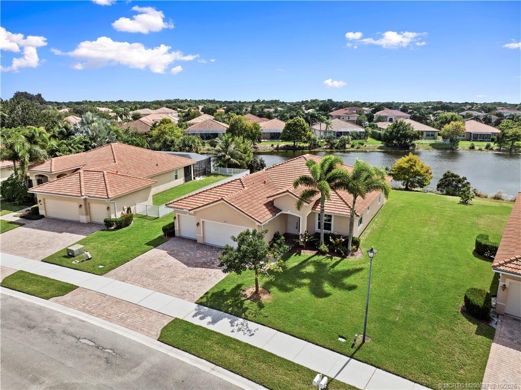 1455 Southeast Conference Circle Stuart, FL 34997 - Photo 50 of 69 an aerial view of a house with a garden