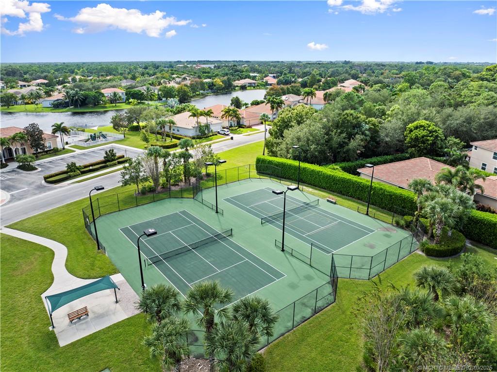 1455 Southeast Conference Circle Stuart, FL 34997 - Photo 57 of 69 an aerial view of a tennis ground and a building