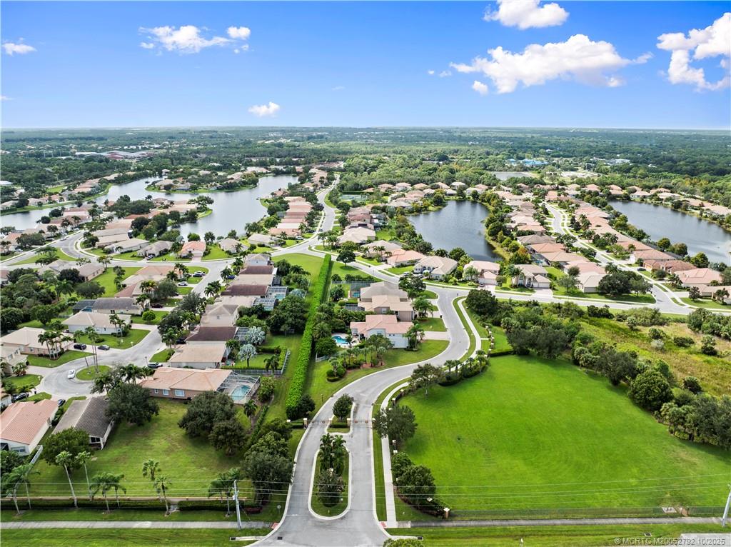 1455 Southeast Conference Circle Stuart, FL 34997 - Photo 65 of 69 an aerial view of residential houses with outdoor space