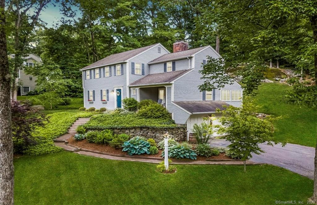 115 Olde Wood Road Glastonbury, CT 06033 - Photo 1 of 1 a front view of a house with a yard