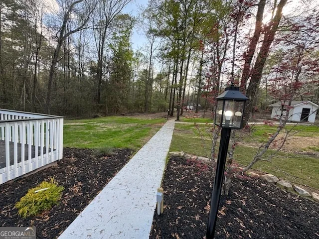 a front view of a garden with a fountain