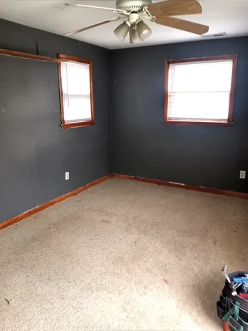 a view of an empty room with a window