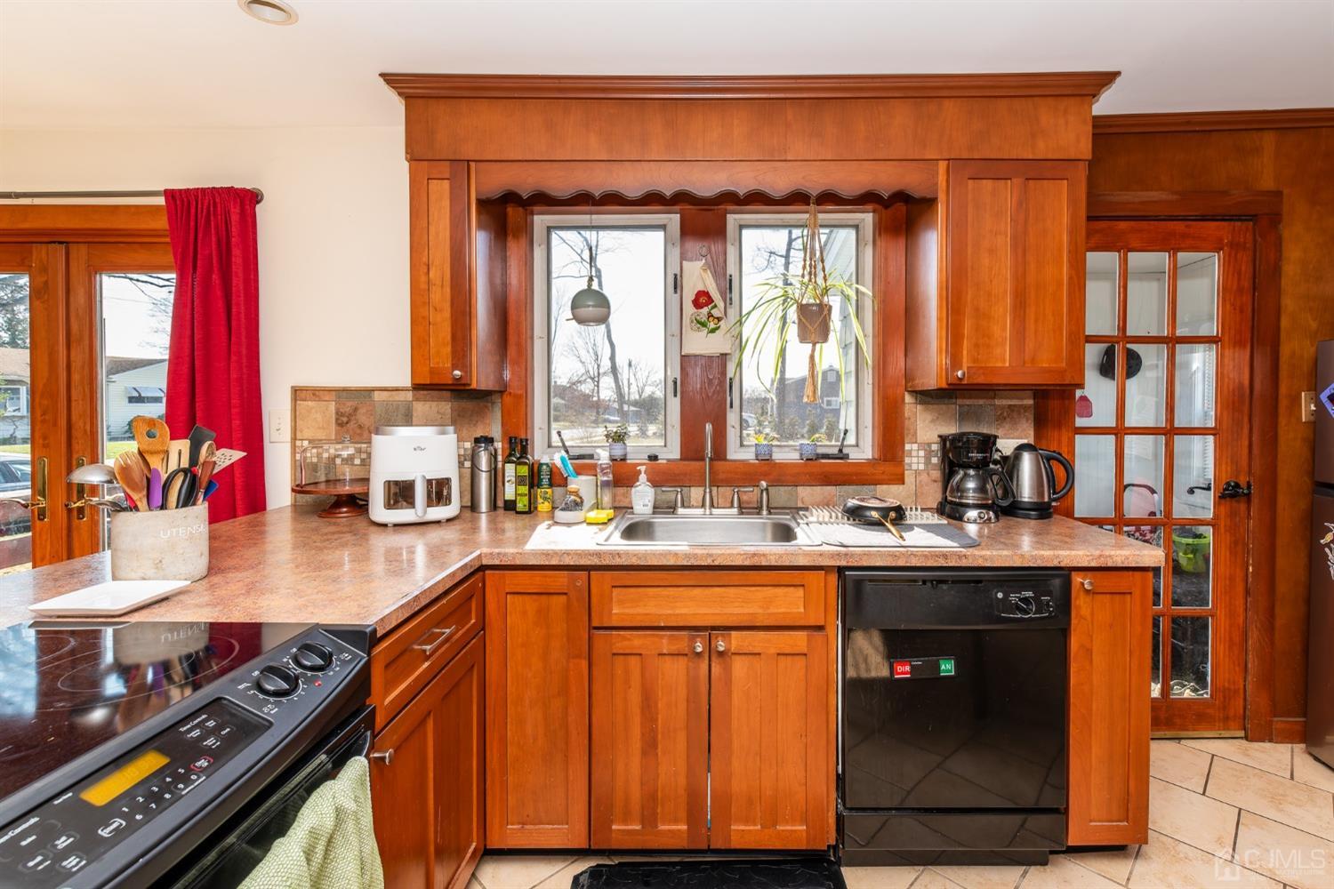 56 Half Acre Road Jamesburg, NJ 08831 - Photo 13 of 31 a kitchen with a sink stove and cabinets