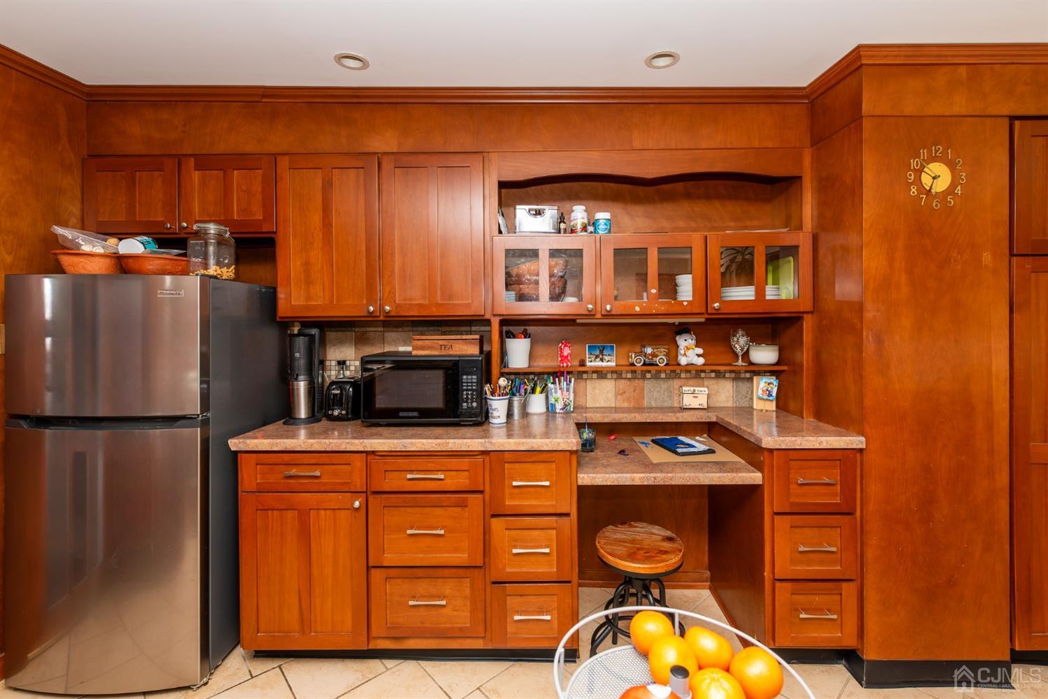 56 Half Acre Road Jamesburg, NJ 08831 - Photo 14 of 31 a kitchen with stainless steel appliances granite countertop a refrigerator a stove and a sink with wooden floor
