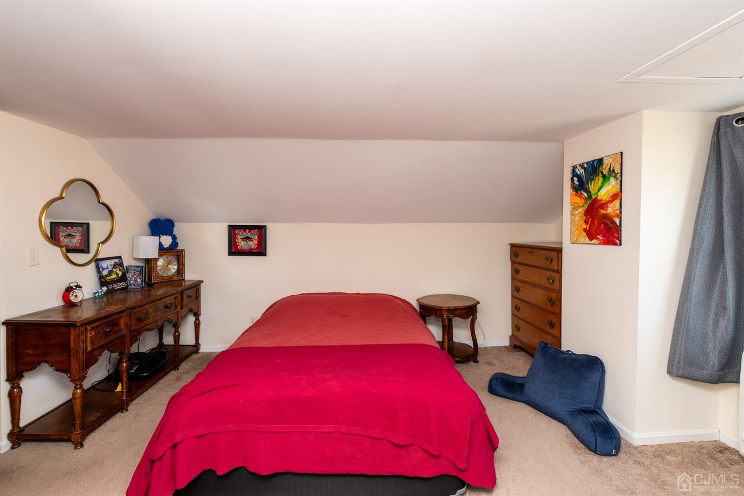 56 Half Acre Road Jamesburg, NJ 08831 - Photo 22 of 31 a bedroom with a bed and window