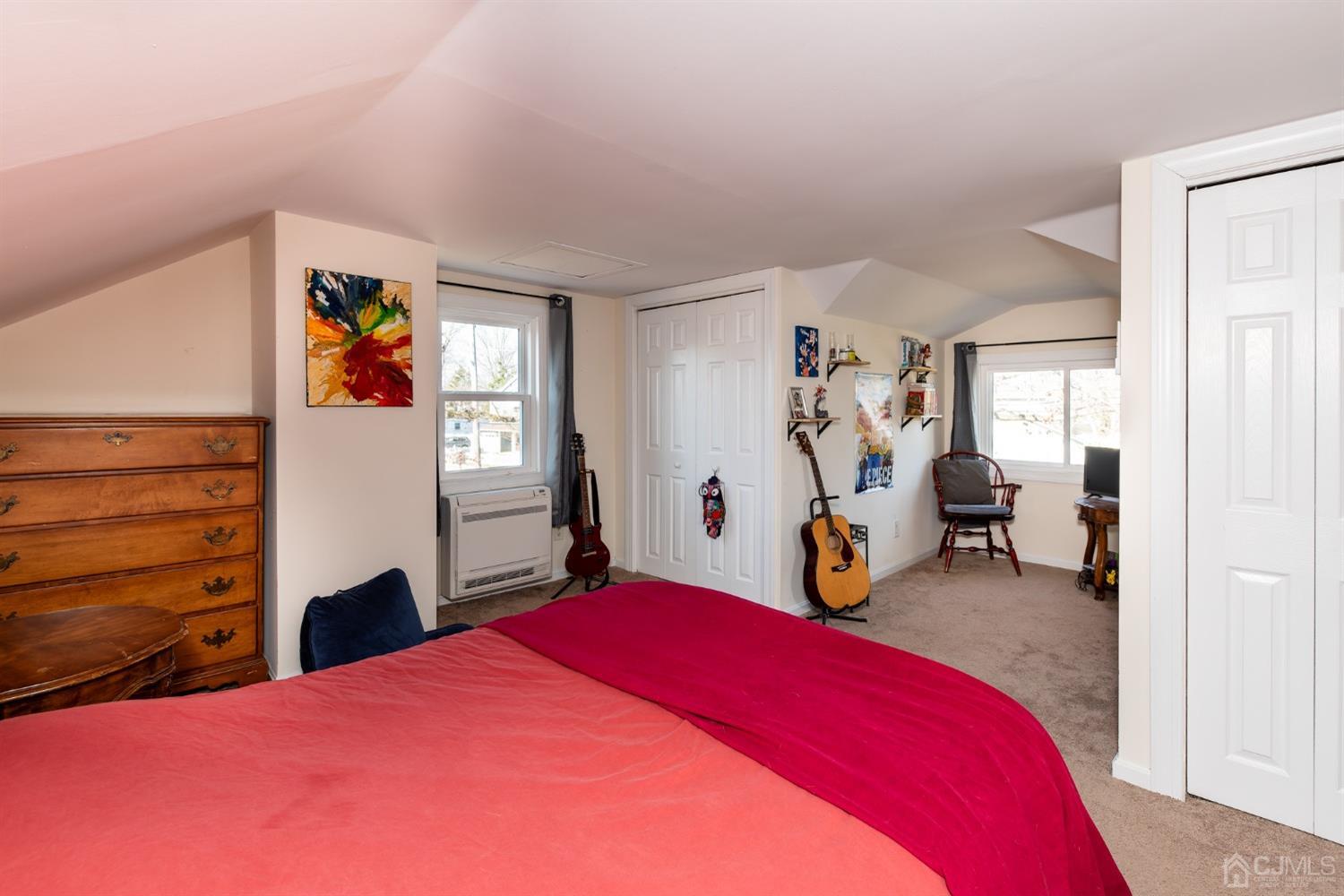 56 Half Acre Road Jamesburg, NJ 08831 - Photo 23 of 31 a bedroom with a bed and cabinets