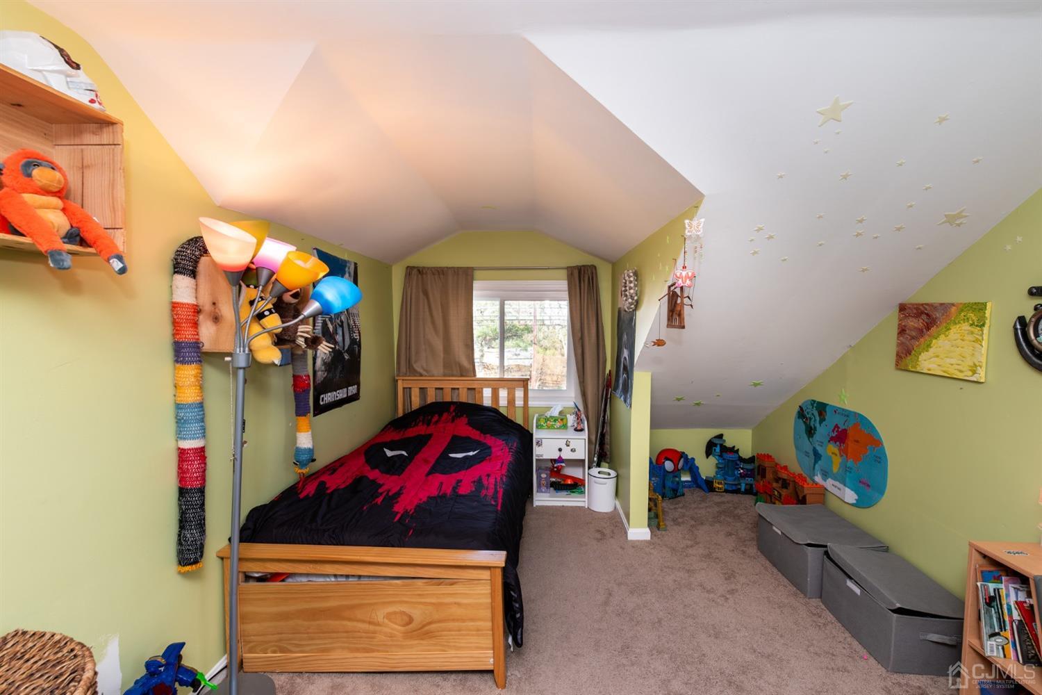 56 Half Acre Road Jamesburg, NJ 08831 - Photo 25 of 31 a bedroom with a bed a window and dresser