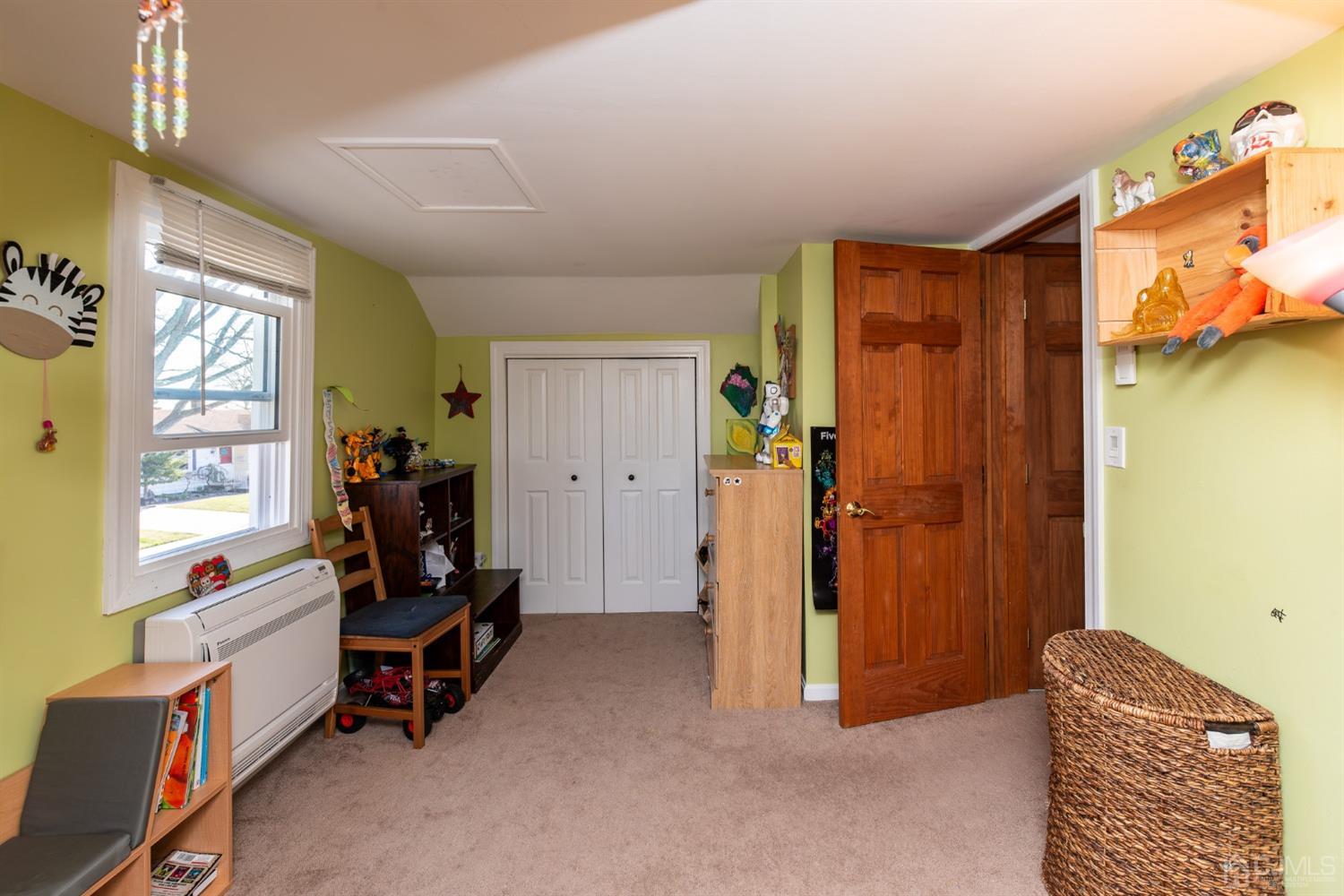 56 Half Acre Road Jamesburg, NJ 08831 - Photo 26 of 31 a view of a bedroom with workspace and a window