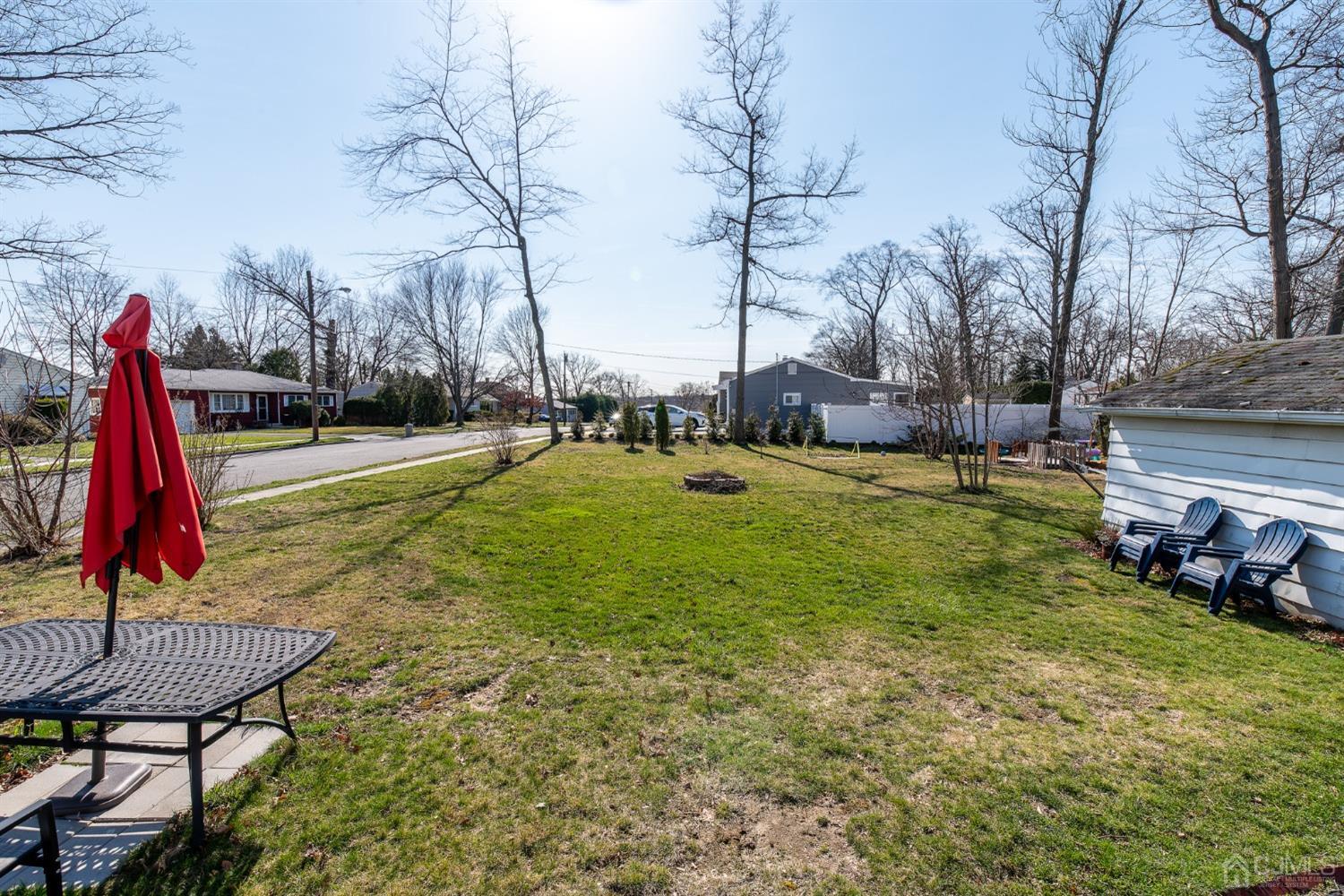 56 Half Acre Road Jamesburg, NJ 08831 - Photo 29 of 31 a view of a backyard with swimming pool