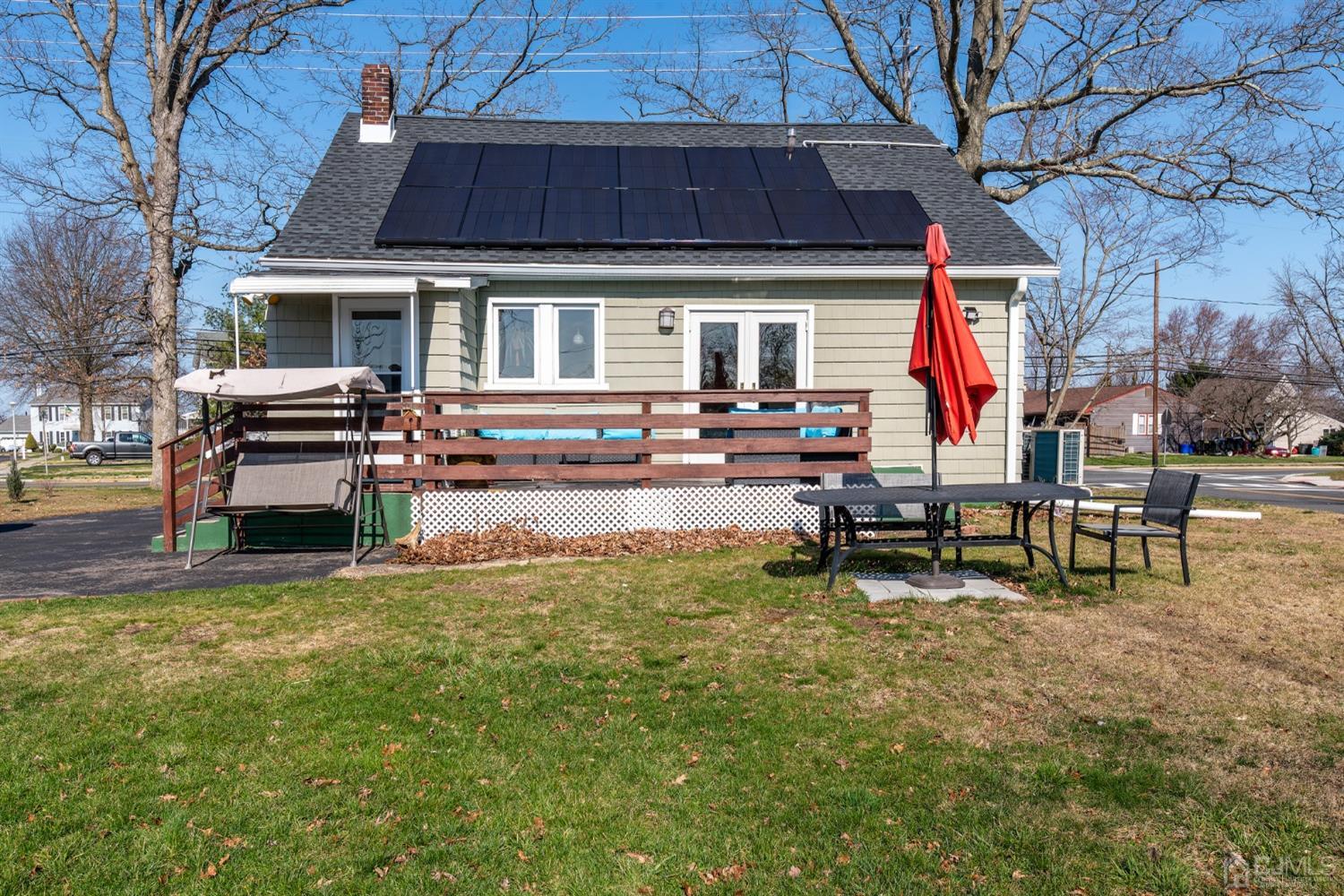 56 Half Acre Road Jamesburg, NJ 08831 - Photo 30 of 31 a view of a house with backyard porch and sitting area