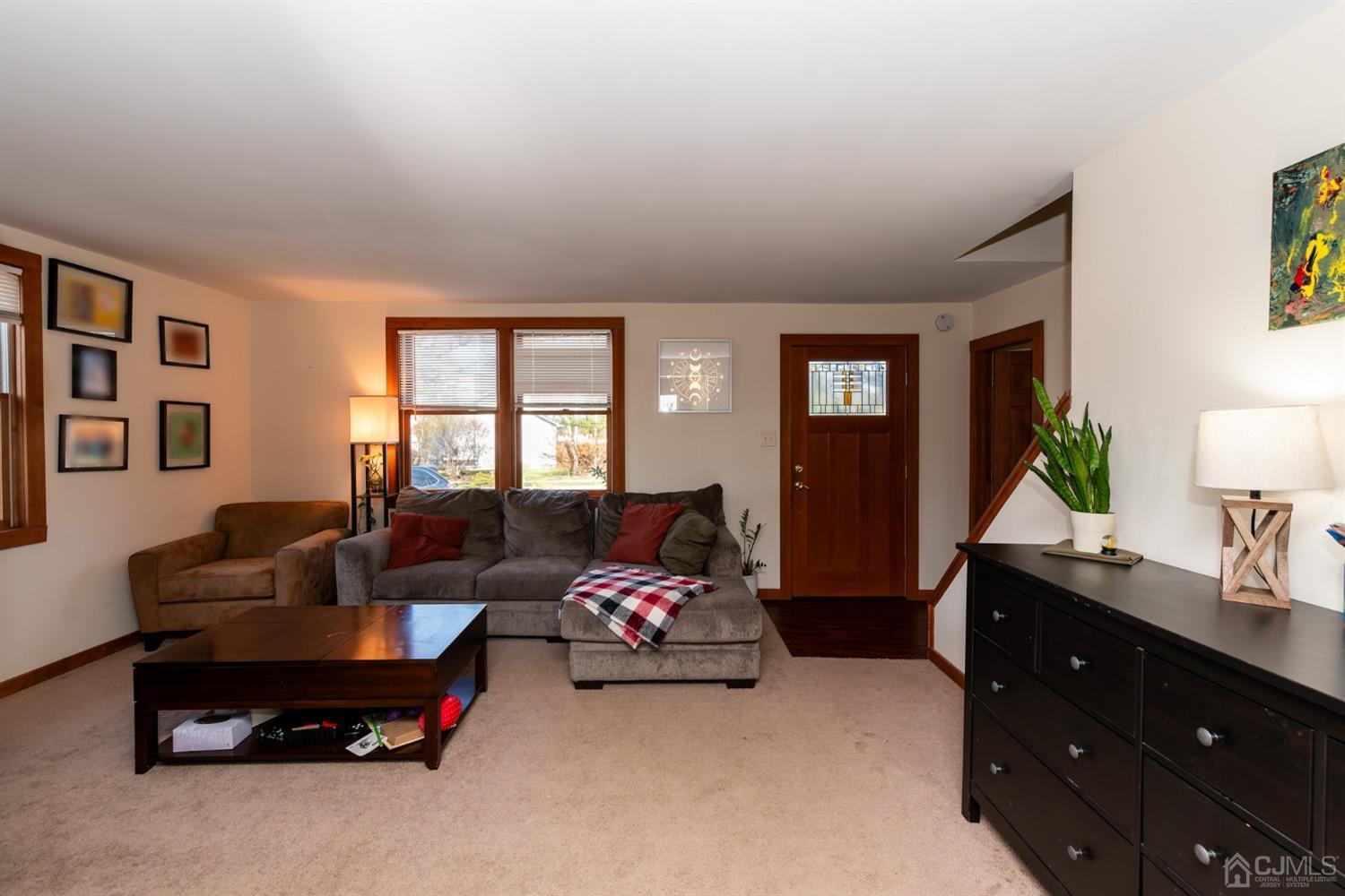 56 Half Acre Road Jamesburg, NJ 08831 - Photo 6 of 31 a living room with furniture and a window