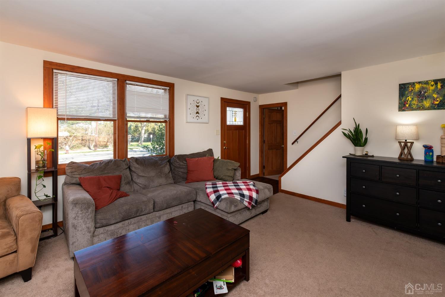 56 Half Acre Road Jamesburg, NJ 08831 - Photo 10 of 31 a living room with furniture and a window