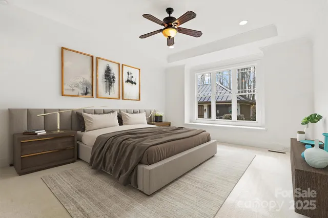 a spacious bedroom with a bed and window