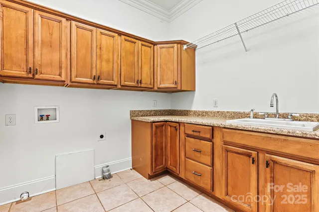 a view of a house with a yard and wooden fence