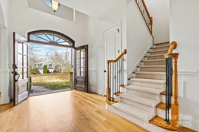 a view of an entryway with wooden floor