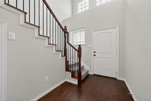 a view of an entryway with wooden floor