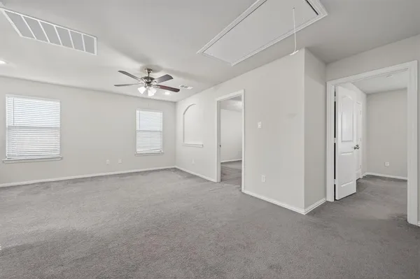 a view of an empty room with a window