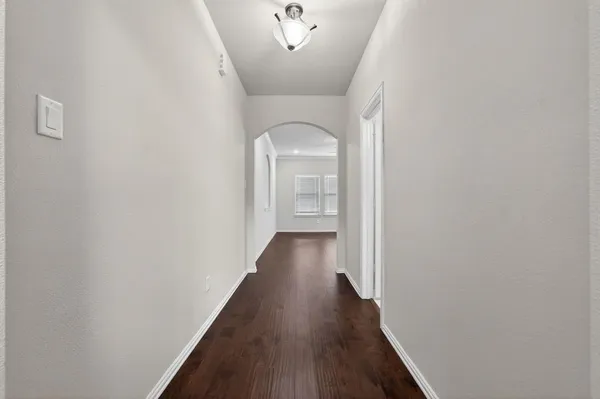 a view of gallery with wooden floor