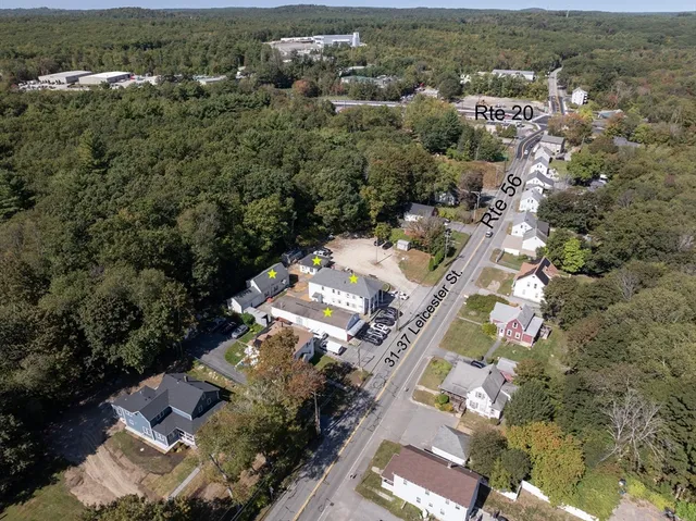 an aerial view of residential houses with outdoor space