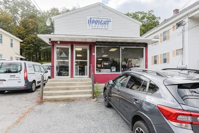 a view of a car park in front of house
