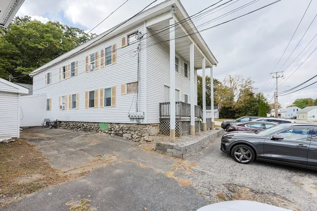 a view of a car parked in front of a house