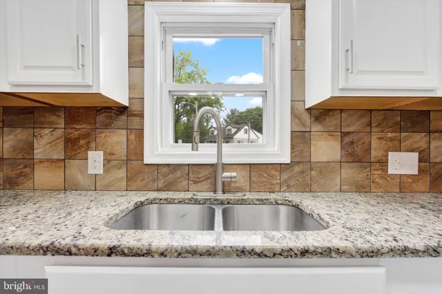 a kitchen with a sink and a window