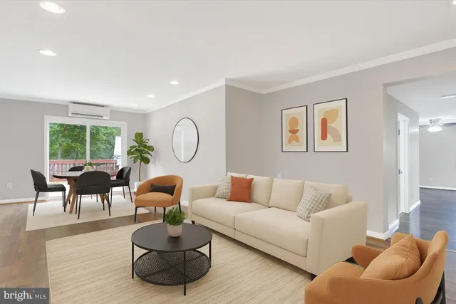 a living room with furniture or couch and a large window