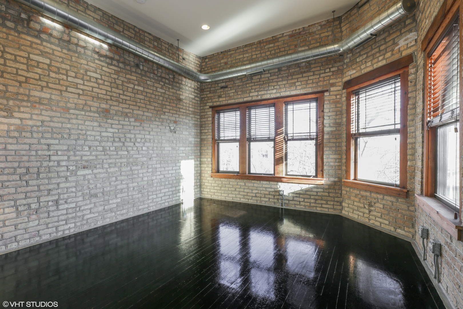 1701 West Greenleaf Avenue, Unit 3 Chicago, IL 60626 - Photo 2 of 10 a view of an empty room with wooden floor and a window