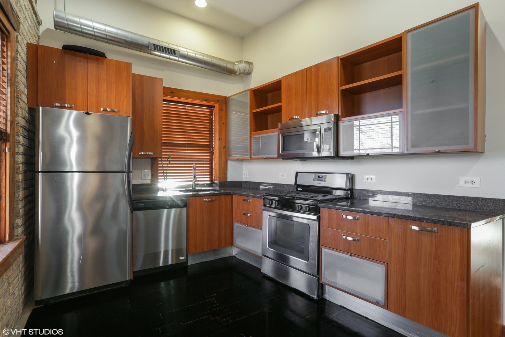 1701 West Greenleaf Avenue, Unit 3 Chicago, IL 60626 - Photo 5 of 10 a kitchen with stainless steel appliances granite countertop a refrigerator a stove and a sink