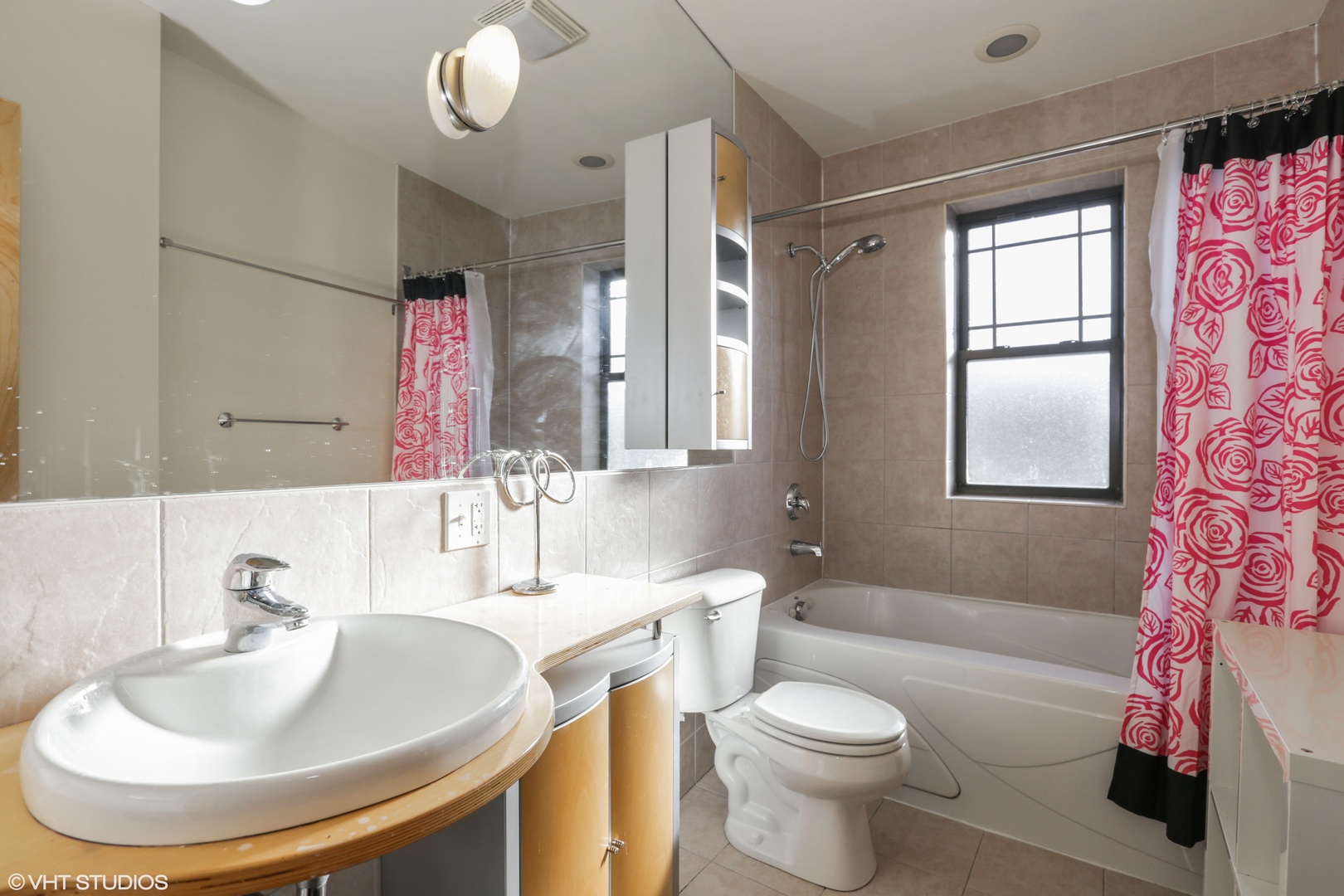 1701 West Greenleaf Avenue, Unit 3 Chicago, IL 60626 - Photo 8 of 10 a bathroom with a sink and a mirror