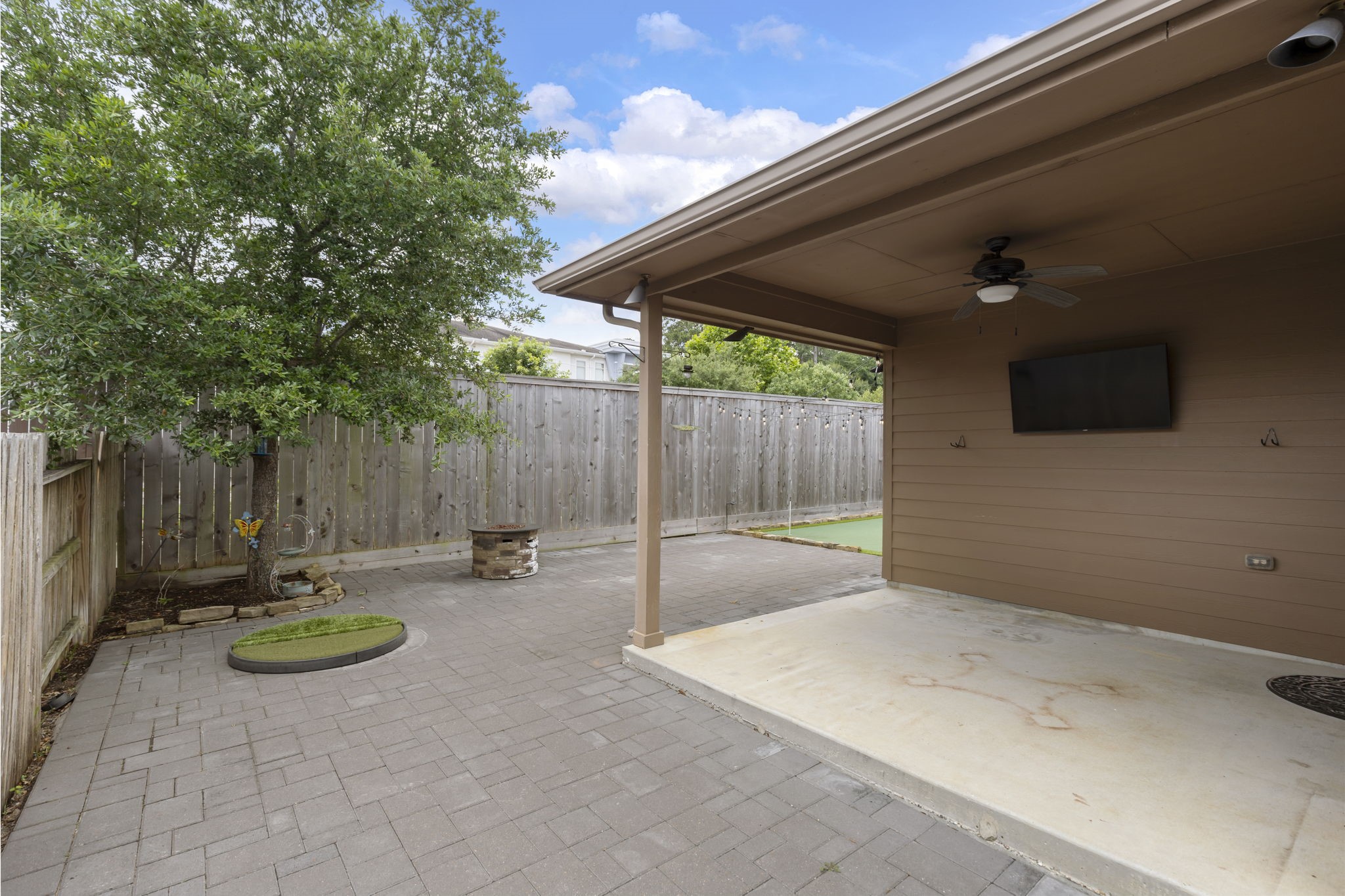 23911 Augusta Falls Lane Spring, TX 77389 - Photo 35 of 40 a backyard of a house with table and chairs