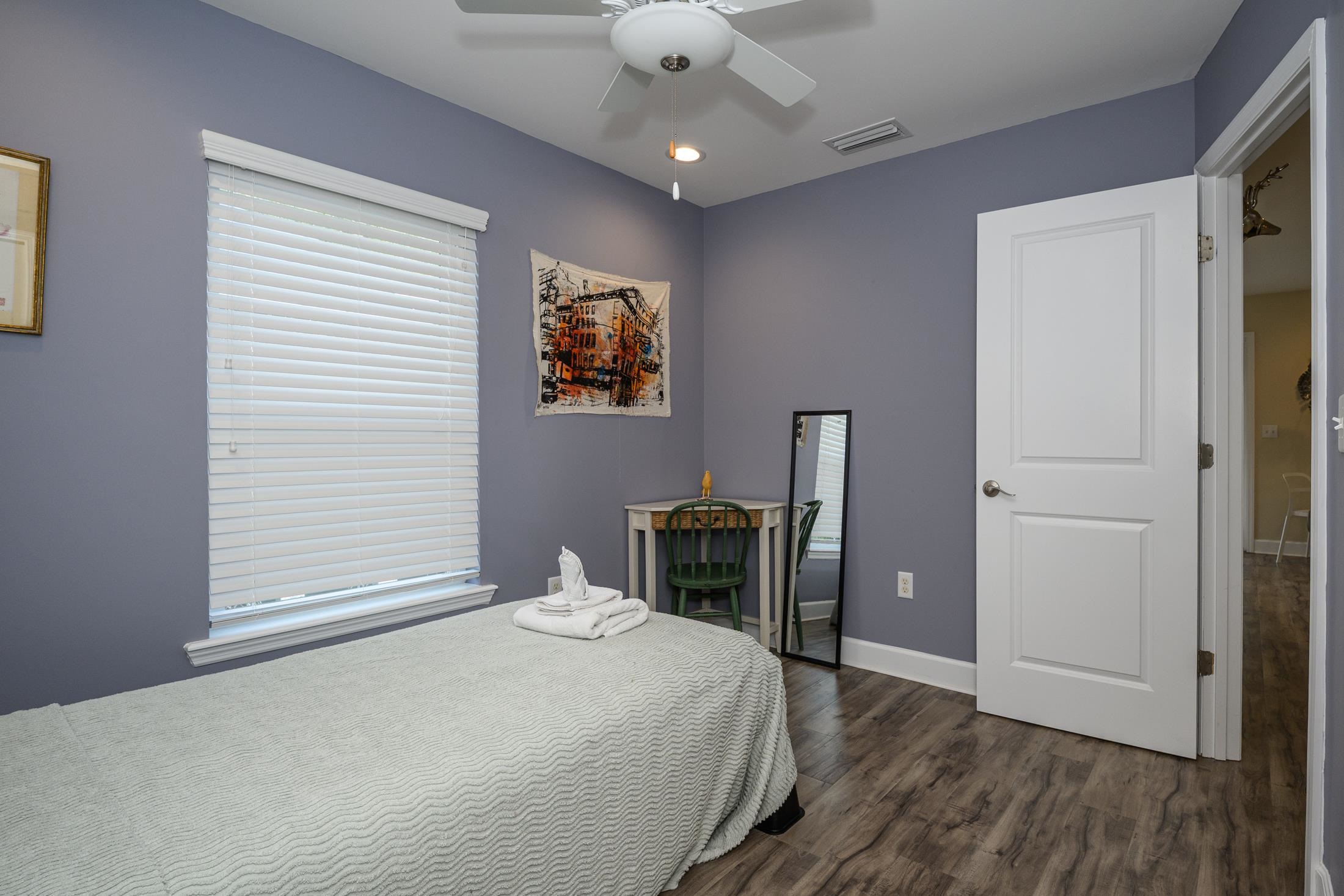 24 Saragossa Street St. Augustine, FL 32084 - Photo 90 of 99 a bedroom with a bed and a chandelier