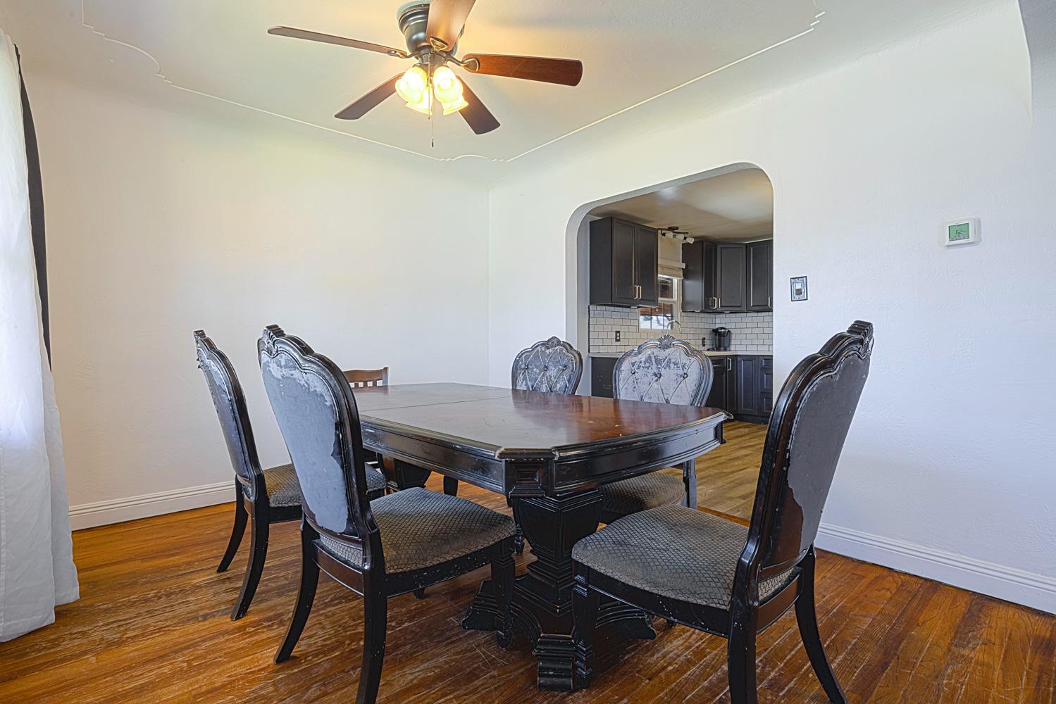 1030 Alpha Road Turlock, CA 95380 - Photo 9 of 25 a view of a dining room with furniture and wooden floor