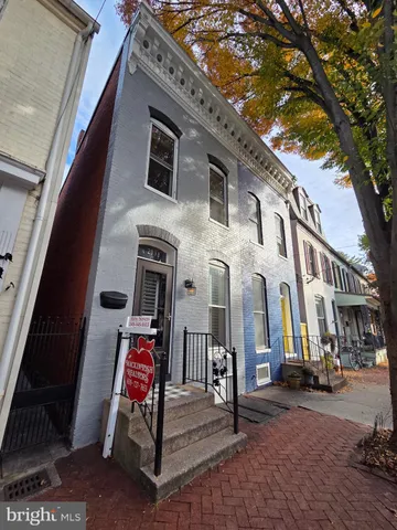 a view of a building with a tree