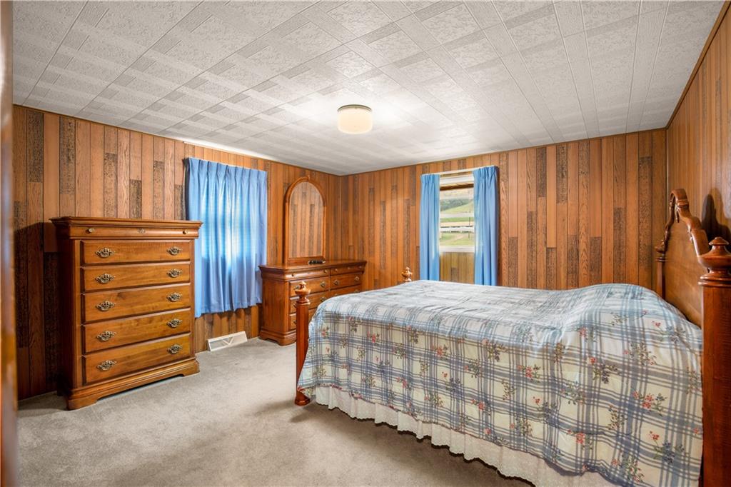 222 McConnell Road Mount Pleasant, PA 15666 - Photo 21 of 37 a bedroom with a bed and a dresser