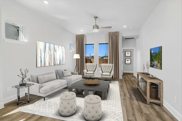 a living room with furniture and a fireplace