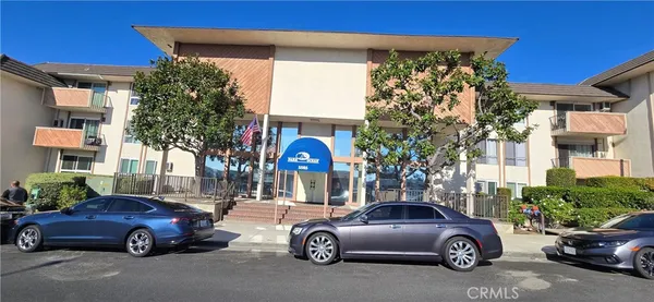 a front view of a house with parking space