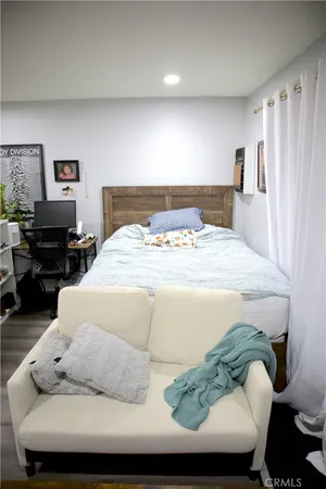 a bedroom with a bed and furniture