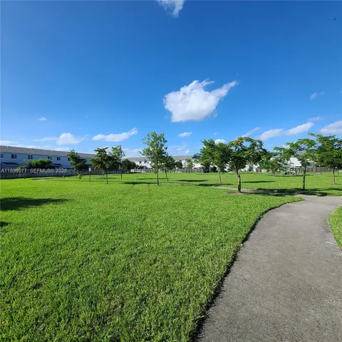 a view of a golf course with a big yard