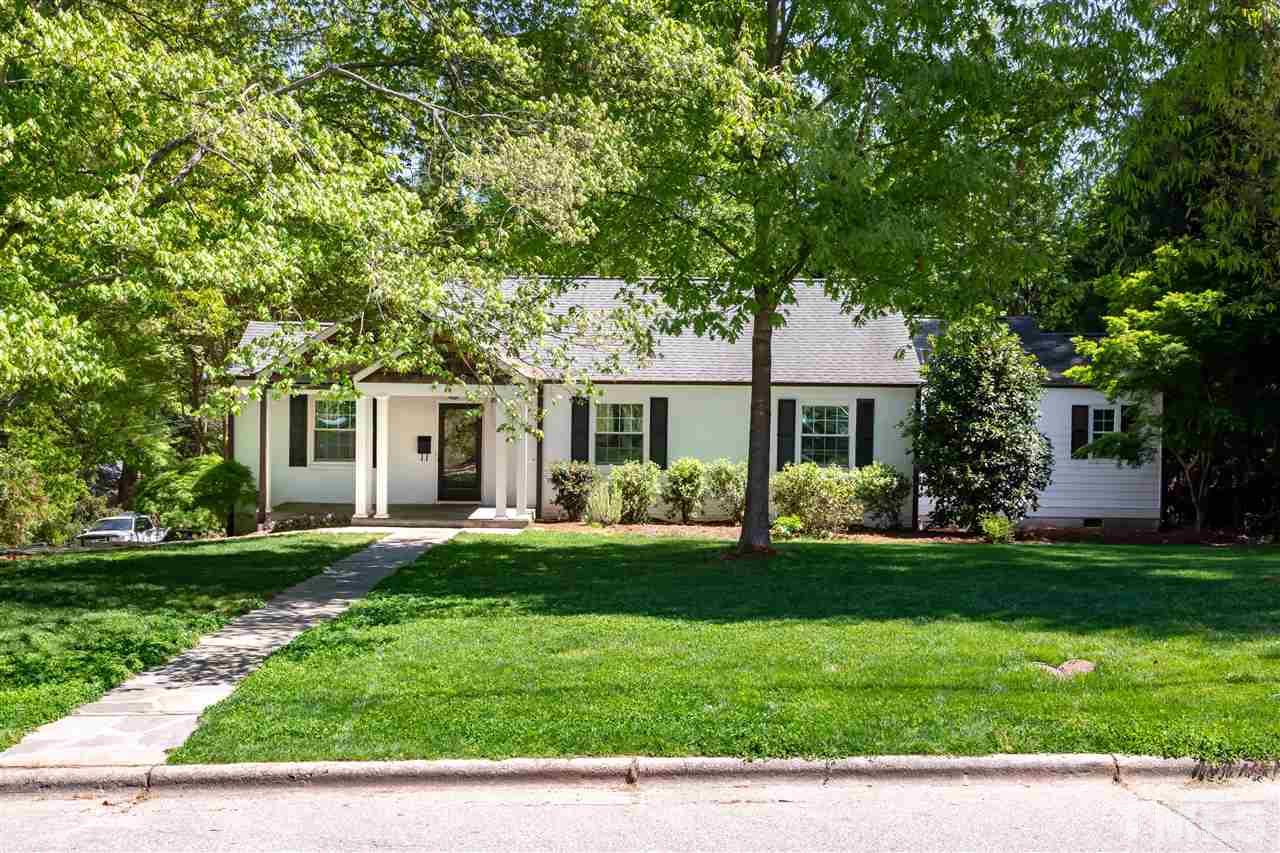914 Canterbury Road Raleigh, NC 27607 - Photo 1 of 29 a front view of a house with a garden