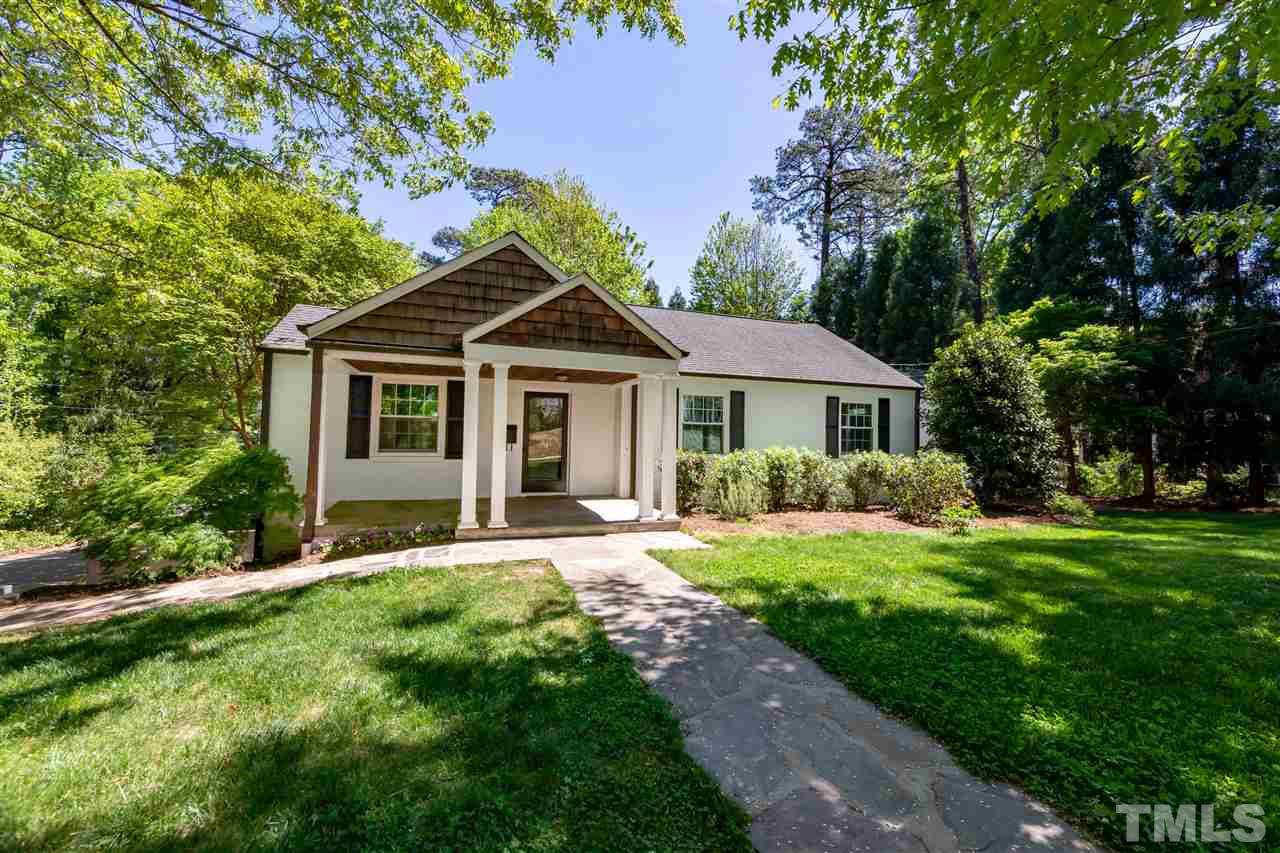 914 Canterbury Road Raleigh, NC 27607 - Photo 2 of 29 a front view of a house with a yard