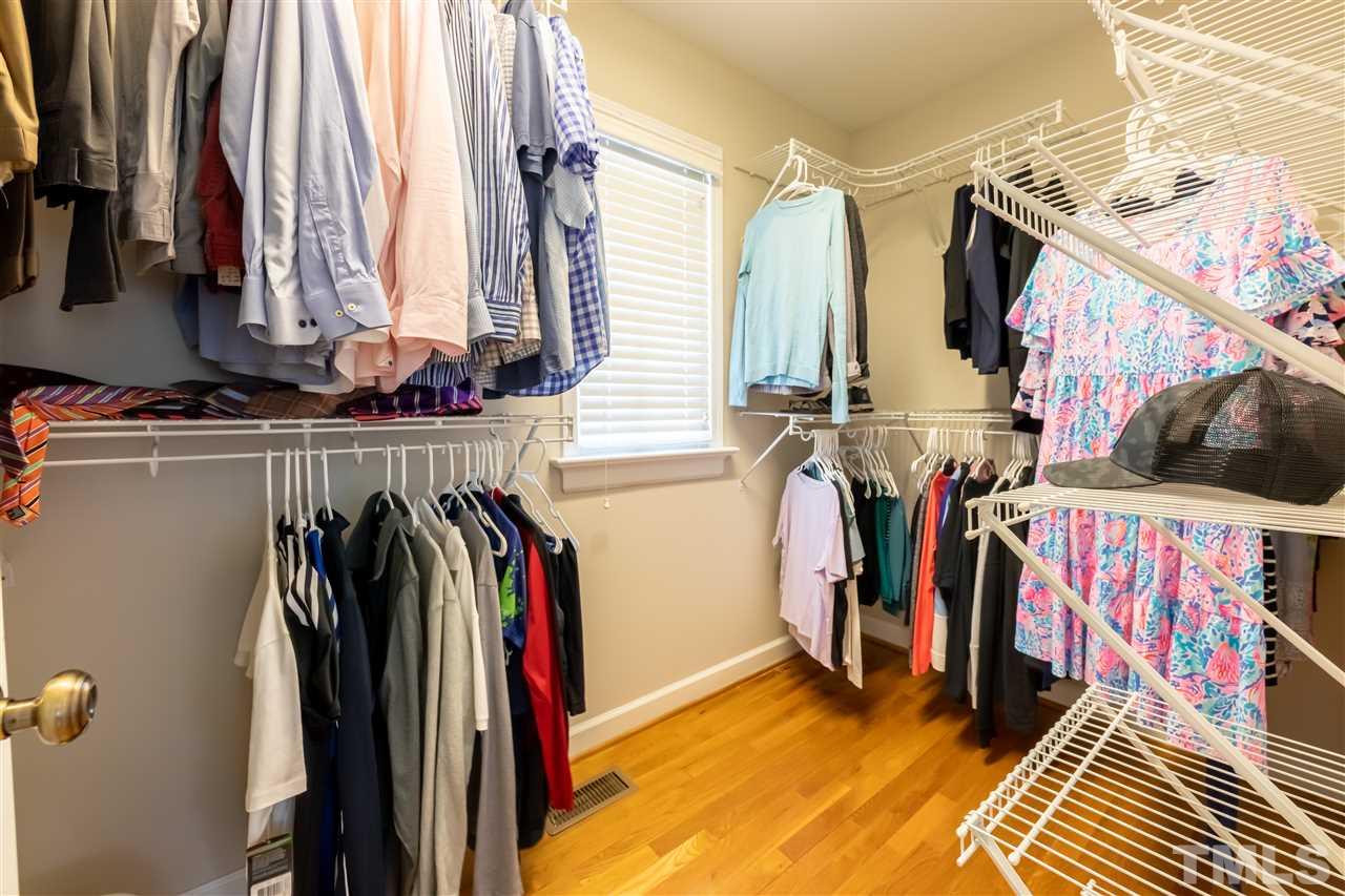 914 Canterbury Road Raleigh, NC 27607 - Photo 15 of 29 a view of walk in closet with clothes and shoes