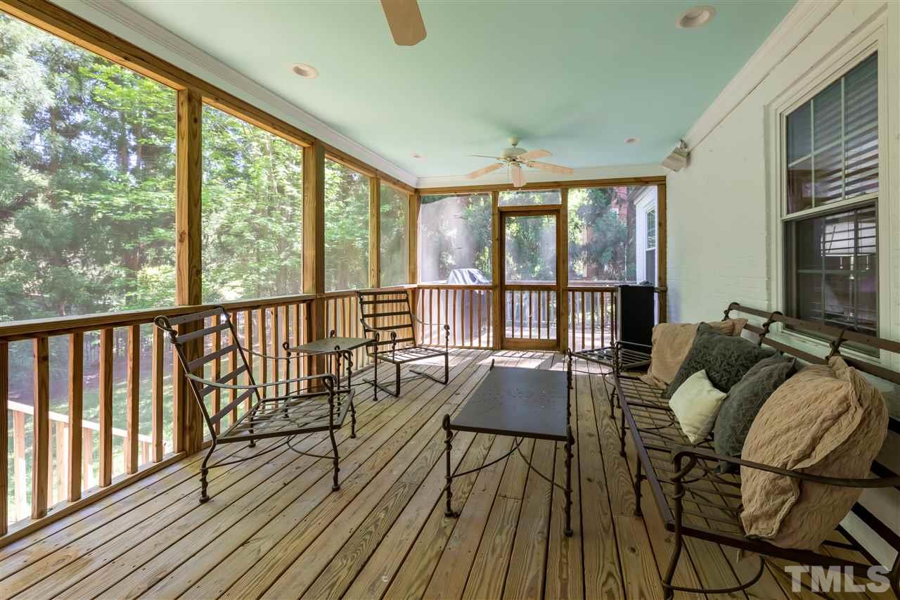 914 Canterbury Road Raleigh, NC 27607 - Photo 19 of 29 a living room with furniture and a large window