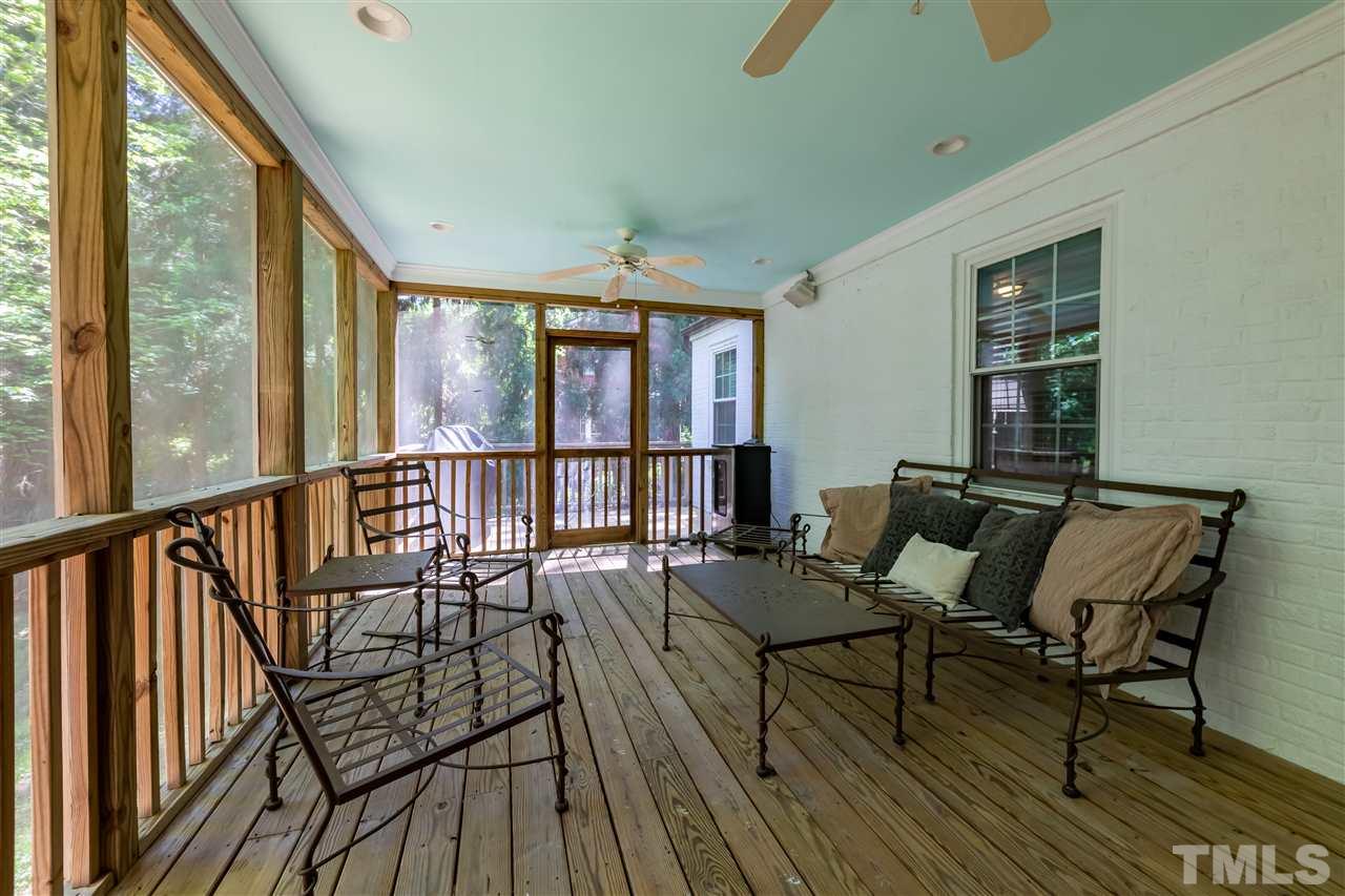 914 Canterbury Road Raleigh, NC 27607 - Photo 23 of 29 a living room with furniture and a large window