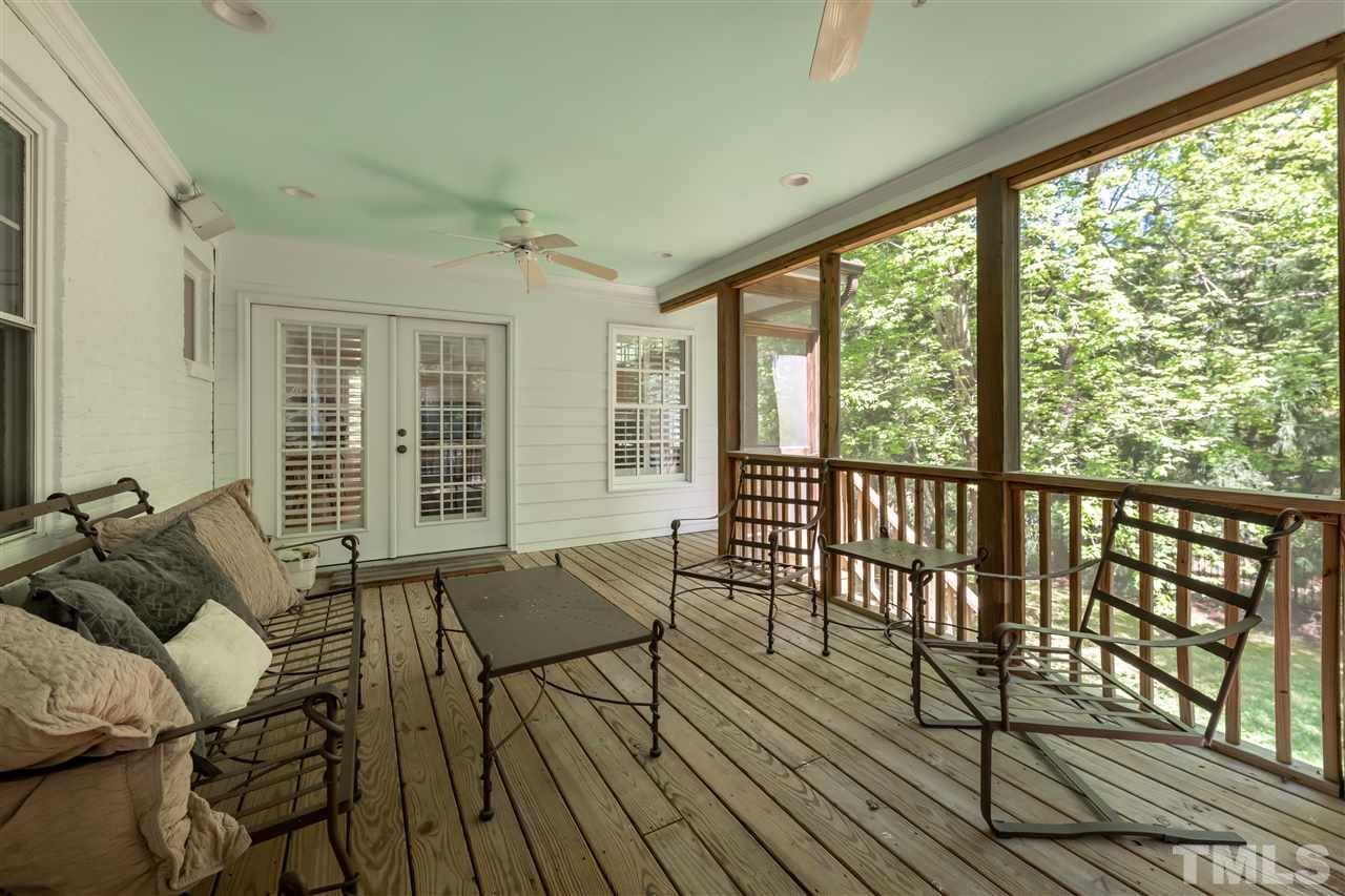 914 Canterbury Road Raleigh, NC 27607 - Photo 24 of 29 a living room with furniture and wooden floor