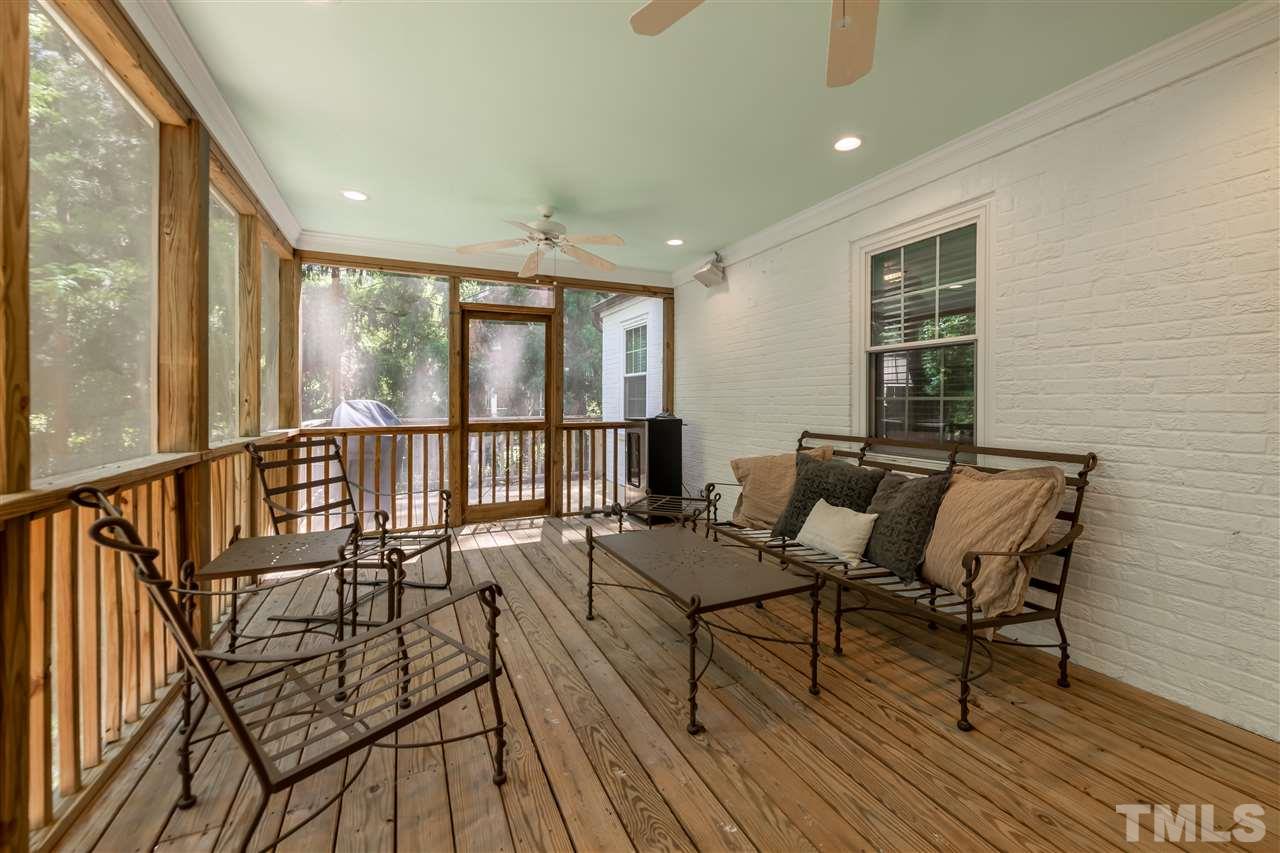 914 Canterbury Road Raleigh, NC 27607 - Photo 25 of 29 a living room with furniture and a table